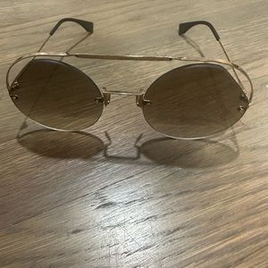 Fendi round gold frame edgy sunglasses.